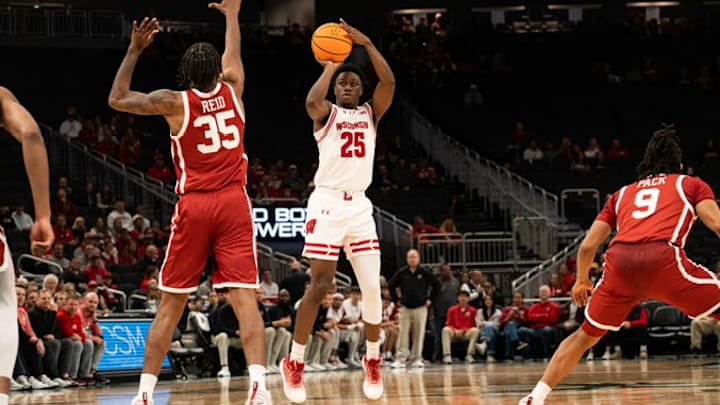 Wisconsin Badgers guard John Blackwell attempts a shot with Oklahoma Sooners forward Derrion Reid defending during exhibition play at Fiserv Forum on October 24, 2025 Wisconsin Badgers guard John Blackwell attempts a shot with Oklahoma Sooners forward Derrion Reid defending during exhibition play at Fiserv Forum on October 24, 2025