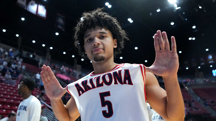 Mar 22, 2026; San Diego, CA, USA; Arizona Wildcats guard Brayden Burries (5) celebrates after defeating the Utah State Aggies during a second round game of the men's 2026 NCAA Tournament at Viejas Arena. Mandatory Credit: Kirby Lee-Imagn Images