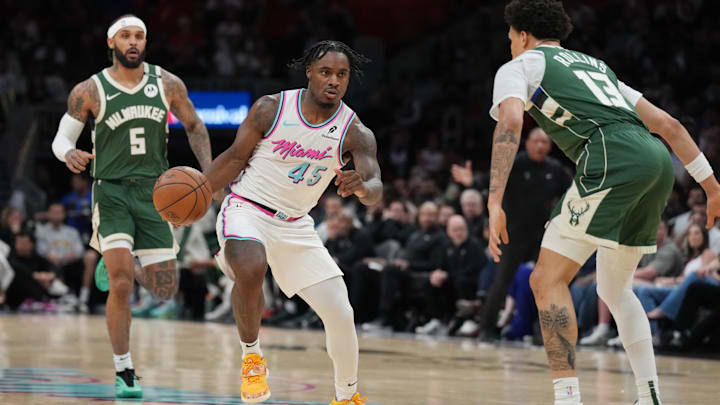 Apr 5, 2025; Miami, Florida, USA; Miami Heat guard Davion Mitchell (45) brings the ball up the court as Milwaukee Bucks guard Ryan Rollins (13) defends during the first half at Kaseya Center. Mandatory Credit: Jim Rassol-Imagn Images Apr 5, 2025; Miami, Florida, USA; Miami Heat guard Davion Mitchell (45) brings the ball up the court as Milwaukee Bucks guard Ryan Rollins (13) defends during the first half at Kaseya Center. Mandatory Credit: Jim Rassol-Imagn Images