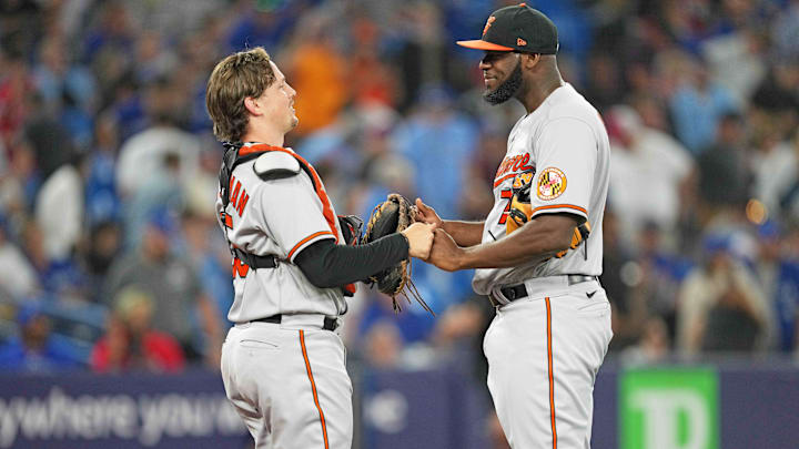 Jul 31, 2023; Toronto, Ontario, CAN; Baltimore Orioles catcher Adley Rutschman (35) celebrates the win with relief pitcher Felix Bautista (74) against the Toronto Blue Jays at Rogers Centre Jul 31, 2023; Toronto, Ontario, CAN; Baltimore Orioles catcher Adley Rutschman (35) celebrates the win with relief pitcher Felix Bautista (74) against the Toronto Blue Jays at Rogers Centre