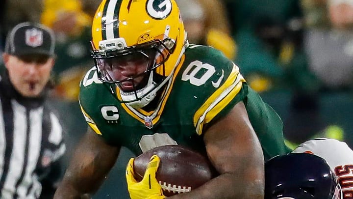 Green Bay Packers running back Josh Jacobs (8) is tackled by Chicago Bears linebacker T.J. Edwards. Green Bay Packers running back Josh Jacobs (8) is tackled by Chicago Bears linebacker T.J. Edwards.