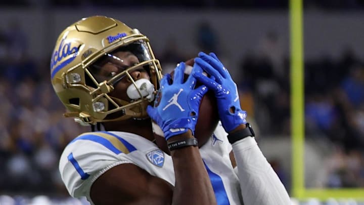 Dec 16, 2023; Inglewood, CA, USA; UCLA Bruins wide receiver J. Michael Sturdivant (1) a touchdown pass against Boise State Broncos cornerback A'Marion McCoy (21) in the fourth quarter of the LA Bowl at SoFi Stadium. Mandatory Credit: Kiyoshi Mio-Imagn Images Dec 16, 2023; Inglewood, CA, USA; UCLA Bruins wide receiver J. Michael Sturdivant (1) a touchdown pass against Boise State Broncos cornerback A'Marion McCoy (21) in the fourth quarter of the LA Bowl at SoFi Stadium. Mandatory Credit: Kiyoshi Mio-Imagn Images