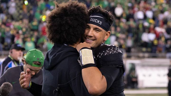 Oregon Ducks quarterback Dylan Raiola hugs Dante Moore Oregon Ducks quarterback Dylan Raiola hugs Dante Moore