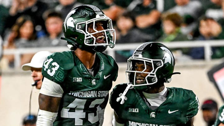 Michigan State's Malik Spencer, left, celebrates a stop with Charles Brantley during the first quarter in the game against Ohio State on Saturday, Sept. 28, 2024, at Spartan Stadium in East Lansing.