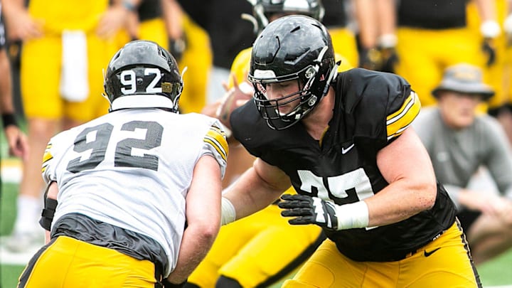 Iowa offensive lineman Connor Colby (77) blocks against defensive lineman John Waggoner (92) during the Kids Day at Kinnick NCAA football practice, Saturday, Aug. 13, 2022, at Kinnick Stadium in Iowa City, Iowa.
220813 Ia Kids Day Fb 082 Jpg Iowa offensive lineman Connor Colby (77) blocks against defensive lineman John Waggoner (92) during the Kids Day at Kinnick NCAA football practice, Saturday, Aug. 13, 2022, at Kinnick Stadium in Iowa City, Iowa.
220813 Ia Kids Day Fb 082 Jpg