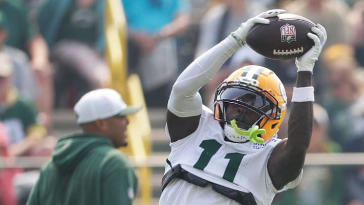 Green Bay Packers wide receiver Jayden Reed catches a pass at practice on July 31.