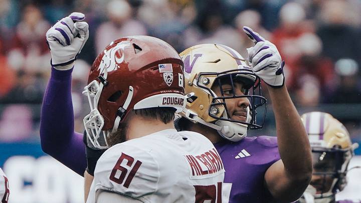 Husky edge rusher Isaiah Ward calls out an offensive formation in the Apple Cup. Husky edge rusher Isaiah Ward calls out an offensive formation in the Apple Cup.