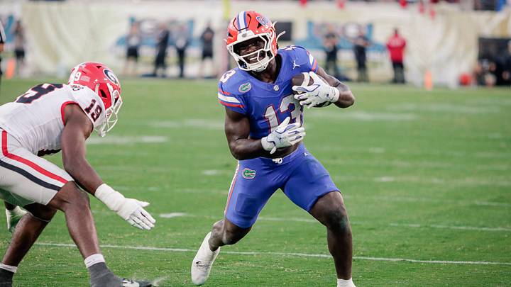 Nov 1, 2025; Jacksonville, Florida, USA; Florida Gators running back Jadan Baugh (13) runs with the ball against the Georgia Bulldogs at EverBank Stadium. Mandatory Credit: Travis Register-Imagn Images Nov 1, 2025; Jacksonville, Florida, USA; Florida Gators running back Jadan Baugh (13) runs with the ball against the Georgia Bulldogs at EverBank Stadium. Mandatory Credit: Travis Register-Imagn Images