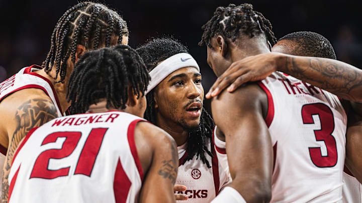 Boogie Fland (2) leads the huddle with Adou Thiero (3), Johnell Davis (1), DJ Wagner (21), Trevon Brazile (4) against the Troy Trojans. The Razorbacks won 65-49.