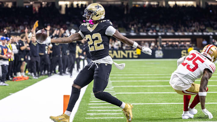 Sep 14, 2025; New Orleans, Louisiana, USA; New Orleans Saints wide receiver Rashid Shaheed (22) scores a touchdown against San Francisco 49ers safety Jason Pinnock (25) during the second half at Caesars Superdome. 