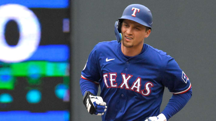 May 26, 2024; Minneapolis, Minnesota, USA;  Texas Rangers infielder Corey Seager (5) rounds the bases after hitting a two-run home run against the Minnesota Twins during the third inning at Target Field. Mandatory Credit: Nick Wosika-USA TODAY Sports