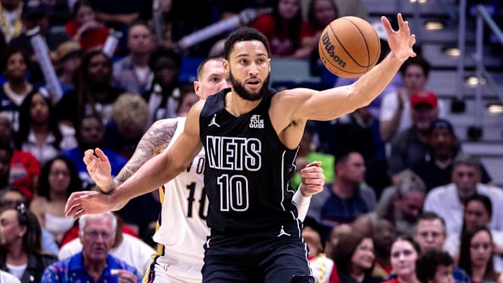 Brooklyn Nets guard Ben Simmons (10) is guarded by New Orleans Pelicans center Daniel Theis (10) on a pass during the second half at Smoothie King Center. Mandatory Credit: Stephen Lew-Imagn Images