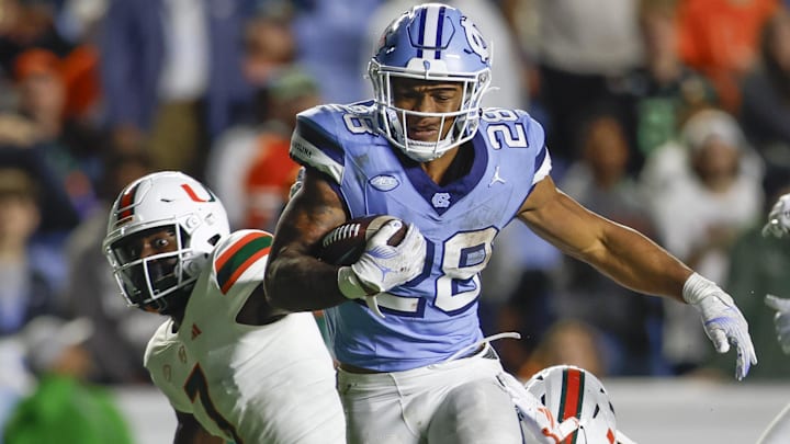 Oct 14, 2023; Chapel Hill, North Carolina, USA; North Carolina Tar Heels running back Omarion Hampton (28) carries the ball against the Miami Hurricanes in the second half at Kenan Memorial Stadium. 