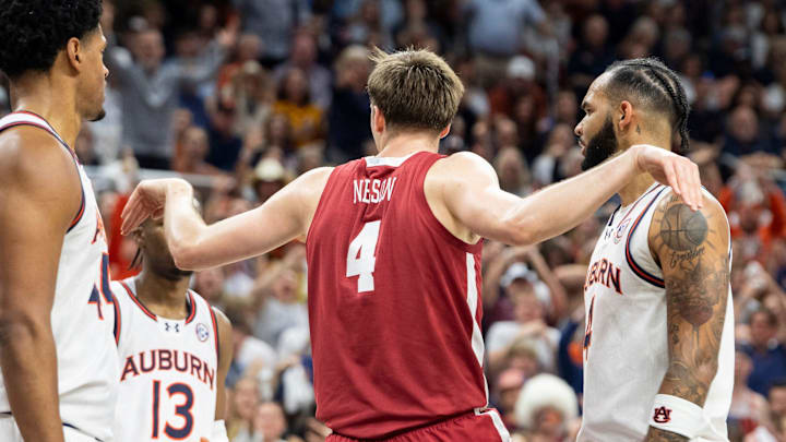Alabama Crimson Tide forward Grant Nelson (4) celebrates his dunk as Auburn Tigers take on Alabama Crimson Tide at Neville Arena in Auburn, Ala., on Saturday, March 8, 2025. Alabama Crimson Tide lead Auburn Tigers 45-42 at halftime. Alabama Crimson Tide forward Grant Nelson (4) celebrates his dunk as Auburn Tigers take on Alabama Crimson Tide at Neville Arena in Auburn, Ala., on Saturday, March 8, 2025. Alabama Crimson Tide lead Auburn Tigers 45-42 at halftime.