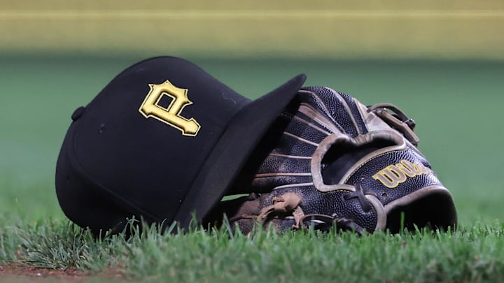 Sep 16, 2025; Pittsburgh, Pennsylvania, USA; A hat and glove belonging to Pittsburgh Pirates third baseman Jared Triolo (not pictured) on the field against the Chicago Cubs during the sixth inning at PNC Park. Mandatory Credit: Charles LeClaire-Imagn Images Sep 16, 2025; Pittsburgh, Pennsylvania, USA; A hat and glove belonging to Pittsburgh Pirates third baseman Jared Triolo (not pictured) on the field against the Chicago Cubs during the sixth inning at PNC Park. Mandatory Credit: Charles LeClaire-Imagn Images