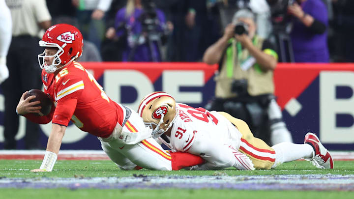 Feb 11, 2024; Paradise, Nevada, USA; Kansas City Chiefs quarterback Patrick Mahomes (15) is tackled by SF 49er Arik Armstead (91).