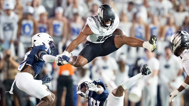 Oregon tight end Kenyon Sadiq hurdles over Penn State cornerback Audavion Collins as the Oregon Ducks face the Penn State Nittany Lions on Sept. 27, 2025, at Beaver Stadium in University Park, Pennsylvania.