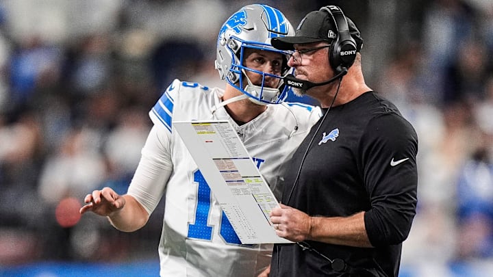 Detroit Lions quarterback Jared Goff (16) talks to head coach Dan Campbell before a play against Dallas Cowboys during the second half at Ford Field in Detroit on Thursday, Dec. 4, 2025.