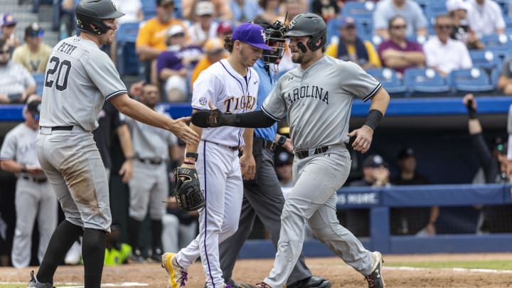 May 25, 2024; Hoover, AL, USA; South Carolina Gamecocks utility Ethan Petry (20) greets catcher Cole Messina (19) after both scored on a single by infielder Parker Noland (11) during the SEC Baseball Tournament at Hoover Metropolitan Stadium. Mandatory Credit: Vasha Hunt-USA TODAY Sports May 25, 2024; Hoover, AL, USA; South Carolina Gamecocks utility Ethan Petry (20) greets catcher Cole Messina (19) after both scored on a single by infielder Parker Noland (11) during the SEC Baseball Tournament at Hoover Metropolitan Stadium. Mandatory Credit: Vasha Hunt-USA TODAY Sports