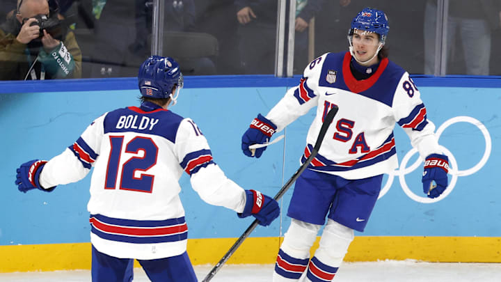 [US, Mexico & Canada customers only] Feb 20, 2026; Milan, Italy; Jack Hughes of United States celebrates scoring their fifth goal with Matt Boldy against Slovakia  in a men's ice hockey semifinal during the Milano Cortina 2026 Olympic Winter Games at Milano Santagiulia Ice Hockey Arena. Mandatory Credit: David W Cerny/Reuters via Imagn Images
