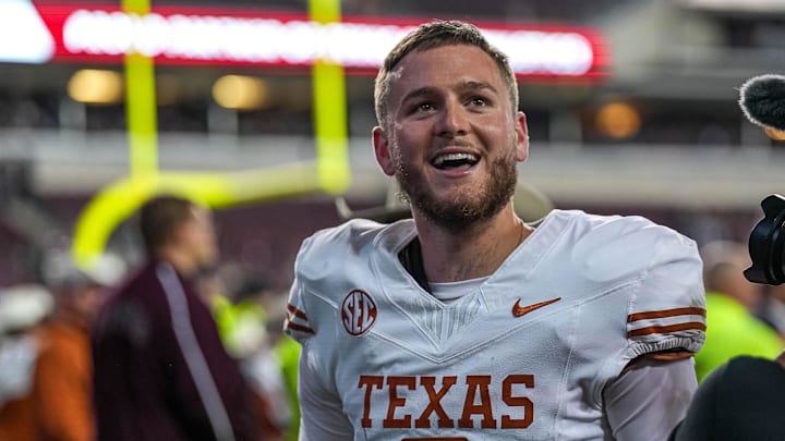 Nov 30, 2024; College Station, Texas, USA; Texas Longhorns quarterback Quinn Ewers (3) celebrates the 17-7 win over Texas A&M in the Lone Star Showdown at Kyle Field. Mandatory Credit: Sara Diggins/USA TODAY Network via Imagn Images