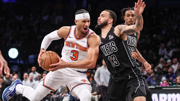 Jan 21, 2025; Brooklyn, New York, USA;  New York Knicks guard Josh Hart (3) looks to drive past Brooklyn Nets guard Tyrese Martin (13) in the second quarter at Barclays Center. Mandatory Credit: Wendell Cruz-Imagn Images