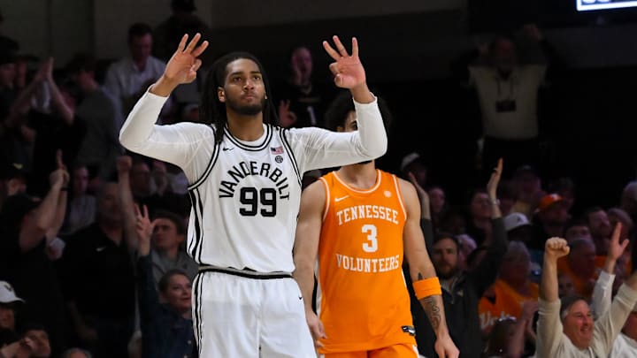 Feb 21, 2026; Nashville, Tennessee, USA;  Vanderbilt Commodores forward Devin McGlockton (99) reacts after a made three point basket made by forward Tyler Nickel (5) against the Tennessee Volunteers during the second half at Memorial Gymnasium. Mandatory Credit: Steve Roberts-Imagn Images