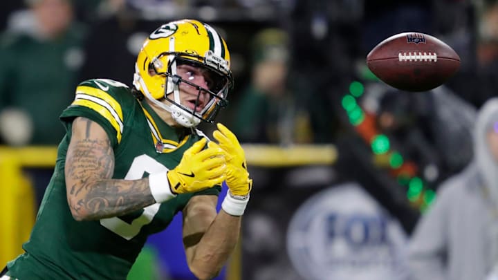 Green Bay Packers wide receiver Christian Watson, shown dropping a pass against the 49ers, will miss the start of next season with a torn ACL. Green Bay Packers wide receiver Christian Watson, shown dropping a pass against the 49ers, will miss the start of next season with a torn ACL.