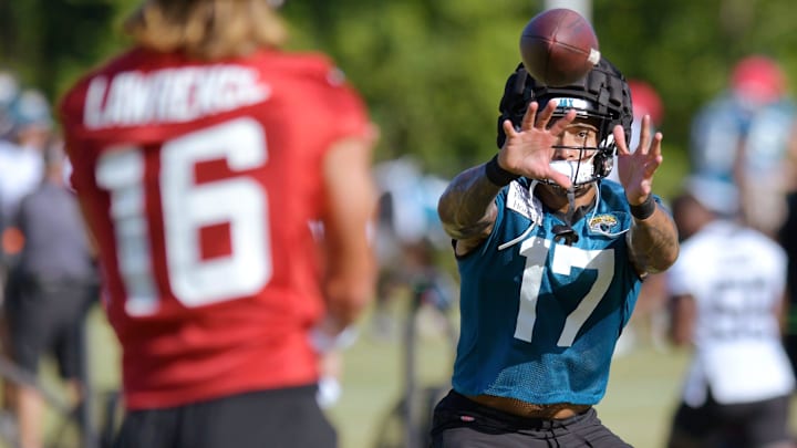 Jacksonville Jaguars tight end Evan Engram (17) pulls in a pass from quarterback Trevor Lawrence. Jacksonville Jaguars tight end Evan Engram (17) pulls in a pass from quarterback Trevor Lawrence.
