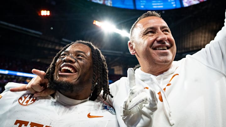 Texas Longhorns running back Jaydon Blue (23) and head coach Steve Sarkisian celebrate the Longhorns 39-31 double overtime win over the Arizona State Sun Devils in the Peach Bowl College Football Playoff quarterfinal at Mercedes-Benz Stadium in Atlanta, Georgia, Jan. 1, 2025. Texas Longhorns running back Jaydon Blue (23) and head coach Steve Sarkisian celebrate the Longhorns 39-31 double overtime win over the Arizona State Sun Devils in the Peach Bowl College Football Playoff quarterfinal at Mercedes-Benz Stadium in Atlanta, Georgia, Jan. 1, 2025.