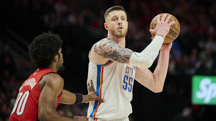 Jan 26, 2025; Portland, Oregon, USA; Oklahoma City Thunder center Isaiah Hartenstein (55) looks to pass the ball during the second half against Portland Trail Blazers guard Scoot Henderson (00) at Moda Center. Jan 26, 2025; Portland, Oregon, USA; Oklahoma City Thunder center Isaiah Hartenstein (55) looks to pass the ball during the second half against Portland Trail Blazers guard Scoot Henderson (00) at Moda Center.