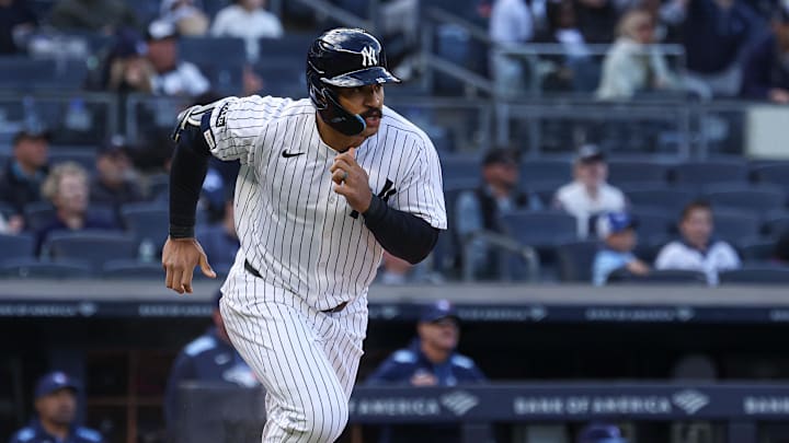 Apr 27, 2025; Bronx, New York, USA; New York Yankees center fielder Trent Grisham (12) runs the bases after his solo home run during the first inning against the Toronto Blue Jays at Yankee Stadium. 
