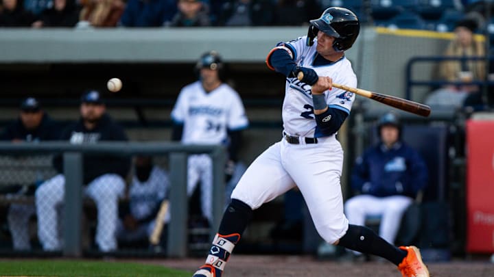 Whitecaps infielder Jace Jung swings the ball at the ball during the Whitecaps home opener Thursday,