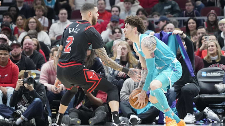 Jan 17, 2025; Chicago, Illinois, USA; Chicago Bulls guard Lonzo Ball (2) defends Charlotte Hornets guard LaMelo Ball (1) during the first quarter at United Center. Mandatory Credit: David Banks-Imagn Images