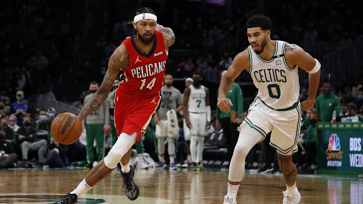 Jan 17, 2022; Boston, Massachusetts, USA; New Orleans Pelicans forward Brandon Ingram (14) dribbles past Boston Celtics forward Jayson Tatum (0) during the second half at TD Garden. Mandatory Credit: Winslow Townson-Imagn Images