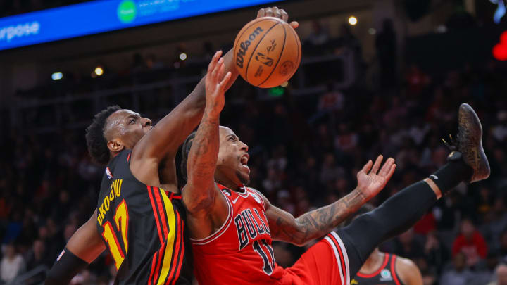 Dec 21, 2022; Atlanta, Georgia, USA; Atlanta Hawks forward Onyeka Okongwu (17) blocks the shot of Chicago Bulls forward DeMar DeRozan (11) in the second half at State Farm Arena. Mandatory Credit: Brett Davis-USA TODAY Sports