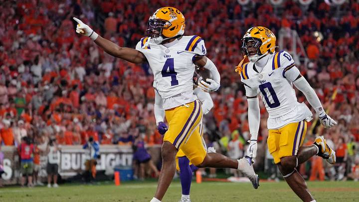 Aug 30, 2025; Clemson, South Carolina, USA; LSU Tigers cornerback Mansoor Delane (4) celebrates with safety Tamarcus Cooley (0) after a play against the Clemson Tigers during the second half at Memorial Stadium. Mandatory Credit: Ken Ruinard-USA TODAY Network via Imagn Images Aug 30, 2025; Clemson, South Carolina, USA; LSU Tigers cornerback Mansoor Delane (4) celebrates with safety Tamarcus Cooley (0) after a play against the Clemson Tigers during the second half at Memorial Stadium. Mandatory Credit: Ken Ruinard-USA TODAY Network via Imagn Images