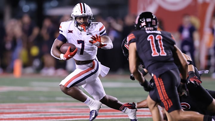 Sep 28, 2024; Salt Lake City, Utah, USA; Arizona Wildcats running back Quali Conley (7) runs against the Utah Utes during the third quarter at Rice-Eccles Stadium. Mandatory Credit: Rob Gray-Imagn Images Sep 28, 2024; Salt Lake City, Utah, USA; Arizona Wildcats running back Quali Conley (7) runs against the Utah Utes during the third quarter at Rice-Eccles Stadium. Mandatory Credit: Rob Gray-Imagn Images