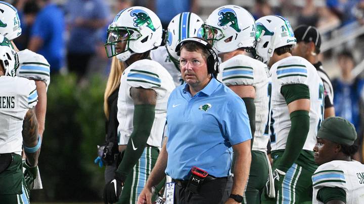 Sep 5, 2026; Durham, North Carolina, USA; Tulane Green Wave head coach Will Hall looks on during the fourth quarter against the Duke Blue Devils at Wallace Wade Stadium. Mandatory Credit: Zachary Taft-Imagn Images Sep 5, 2026; Durham, North Carolina, USA; Tulane Green Wave head coach Will Hall looks on during the fourth quarter against the Duke Blue Devils at Wallace Wade Stadium. Mandatory Credit: Zachary Taft-Imagn Images
