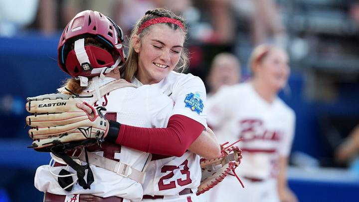 Alabama's Jocelyn Briski (23) celebrates with Marlie Giles (34) following the Women's College World Series softball game between the Alabama Crimson Tide and the UCLA Bruins at Devon Park in Oklahoma City, May 28, 2026. Alabama's Jocelyn Briski (23) celebrates with Marlie Giles (34) following the Women's College World Series softball game between the Alabama Crimson Tide and the UCLA Bruins at Devon Park in Oklahoma City, May 28, 2026.
