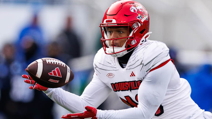 Nov 30, 2024; Lexington, Kentucky, USA; Louisville Cardinals wide receiver Kris Hughes (49) catches a pass during the third quarter against the Kentucky Wildcats at Kroger Field. Mandatory Credit: Jordan Prather-Imagn Images