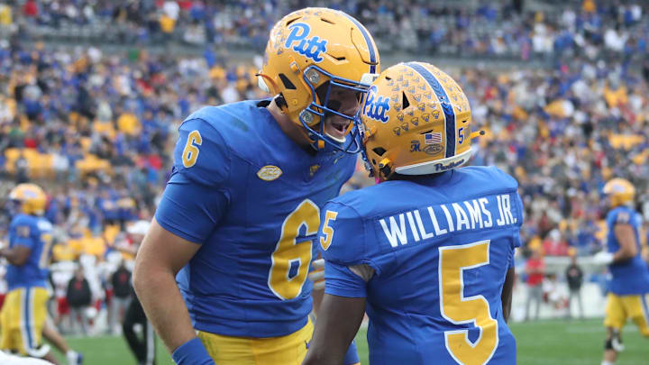 Oct 25, 2025; Pittsburgh, Pennsylvania, USA; Pittsburgh Panthers quarterback Mason Heintschel (6) and wide receiver Raphael Williams Jr. (5) celebrate after combining for a touchdown against the North Carolina State Wolfpack during the second quarter at Acrisure Stadium. Mandatory Credit: Charles LeClaire-Imagn Images Oct 25, 2025; Pittsburgh, Pennsylvania, USA; Pittsburgh Panthers quarterback Mason Heintschel (6) and wide receiver Raphael Williams Jr. (5) celebrate after combining for a touchdown against the North Carolina State Wolfpack during the second quarter at Acrisure Stadium. Mandatory Credit: Charles LeClaire-Imagn Images