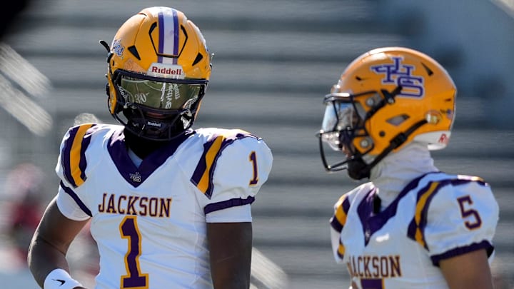 Dec 6, 2024; Birmingham, AL, USA; Jackson's Landon Duckworth (1) and Jackson's Chris Payne (5) talk during a timeout during the game with Cherokee County at Protective Stadium in the AHSAA 4A State Championship game.