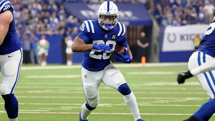 Oct 5, 2025; Indianapolis, Indiana, USA; Indianapolis Colts running back Jonathan Taylor (28) runs with the ball against the Las Vegas Raiders during the second quarter at Lucas Oil Stadium. Mandatory Credit: Trevor Ruszkowski-Imagn Images