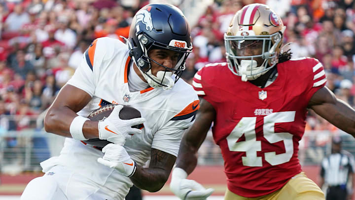Aug 9, 2025; Santa Clara, California, USA;  Denver Broncos wide receiver Devaughn Vele (17) make a reception in the second quarter against San Francisco 49ers linebacker Nick Martin (45) at Levi's Stadium. 