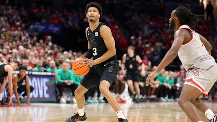 Jan 3, 2025; Columbus, Ohio, USA; Michigan State Spartans guard Jaden Akins (3) sets to shoot the ball during the first half against the Ohio State Buckeyes at Value City Arena. Mandatory Credit: Joseph Maiorana-Imagn Images Jan 3, 2025; Columbus, Ohio, USA; Michigan State Spartans guard Jaden Akins (3) sets to shoot the ball during the first half against the Ohio State Buckeyes at Value City Arena. Mandatory Credit: Joseph Maiorana-Imagn Images