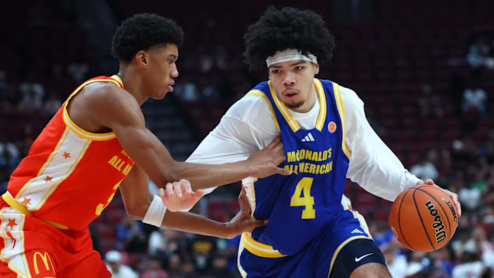 Mar 31, 2026; Glendale, AZ, USA; Tyran Stokes (4) moves the ball against Bruce Branch III (3) during the McDonalds All American Boys Game at Desert Diamond Arena. Mandatory Credit: Mark J. Rebilas-Imagn Images