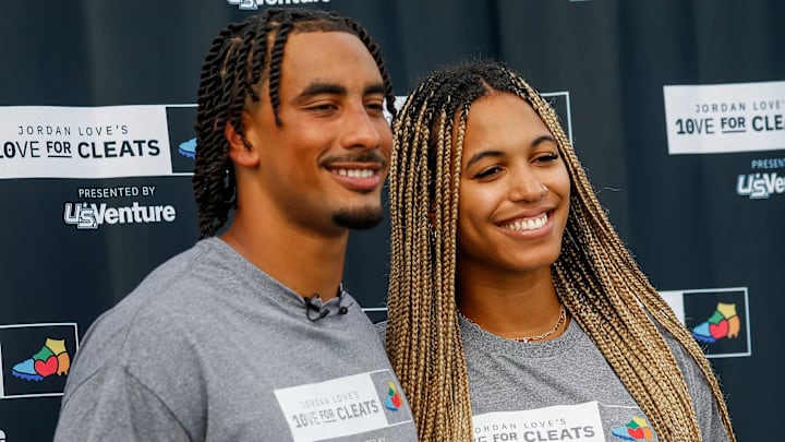 Green Bay Packers quarterback Jordan Love and his fiancée, Ronika Stone, pose for a photo on Monday, August 26, 2024, at Green Bay West High School in Green Bay, Wis. Love’s foundation, Hands of 10ve, is partnering with U.S. Venture to give youth football teams a set of new cleats for each touchdown Love runs or throws for in the 2024 season. Teams will be able to apply for cleats in December, and cleats will be given to teams based on need. Green Bay Packers quarterback Jordan Love and his fiancée, Ronika Stone, pose for a photo on Monday, August 26, 2024, at Green Bay West High School in Green Bay, Wis. Love’s foundation, Hands of 10ve, is partnering with U.S. Venture to give youth football teams a set of new cleats for each touchdown Love runs or throws for in the 2024 season. Teams will be able to apply for cleats in December, and cleats will be given to teams based on need.