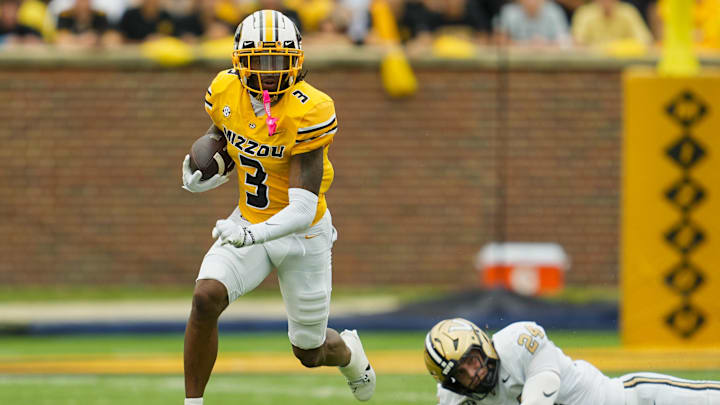 Sep 21, 2024; Columbia, Missouri, USA; Missouri Tigers wide receiver Luther Burden III (3) returns a punt against Vanderbilt Commodores linebacker Nicholas Rinaldi (24) during the first half at Faurot Field at Memorial Stadium. 