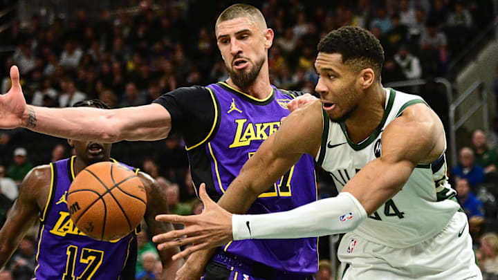  Milwaukee Bucks forward Giannis Antetokounmpo (34) passes the ball away from Los Angeles Lakers center Alex Len (27) in the second quarter at Fiserv Forum. 